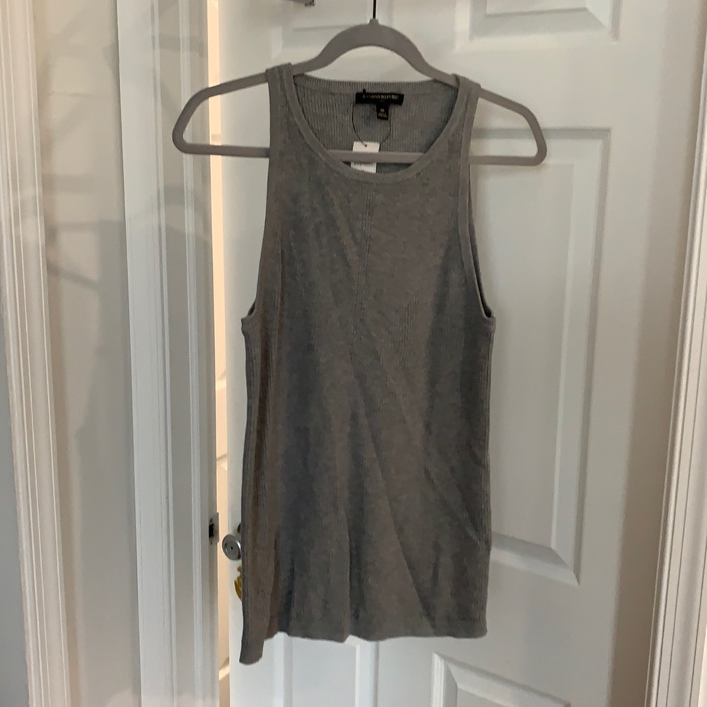 Grey knit top.